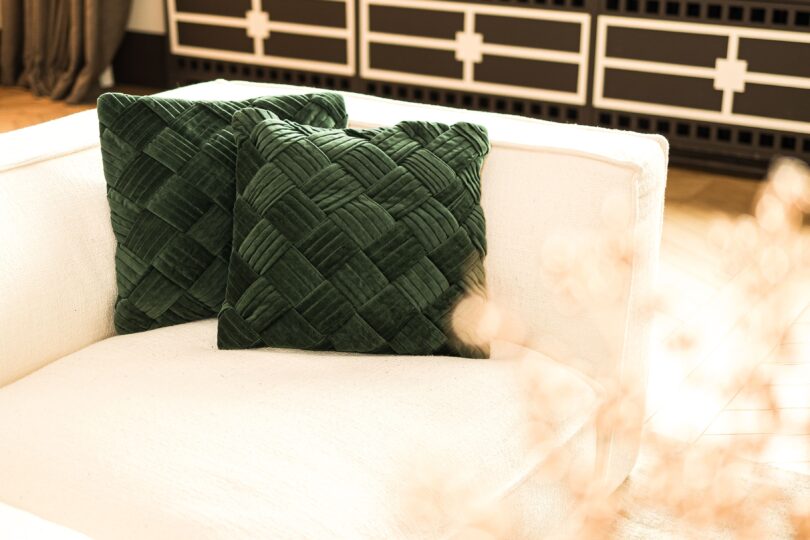 White coach with green pillows